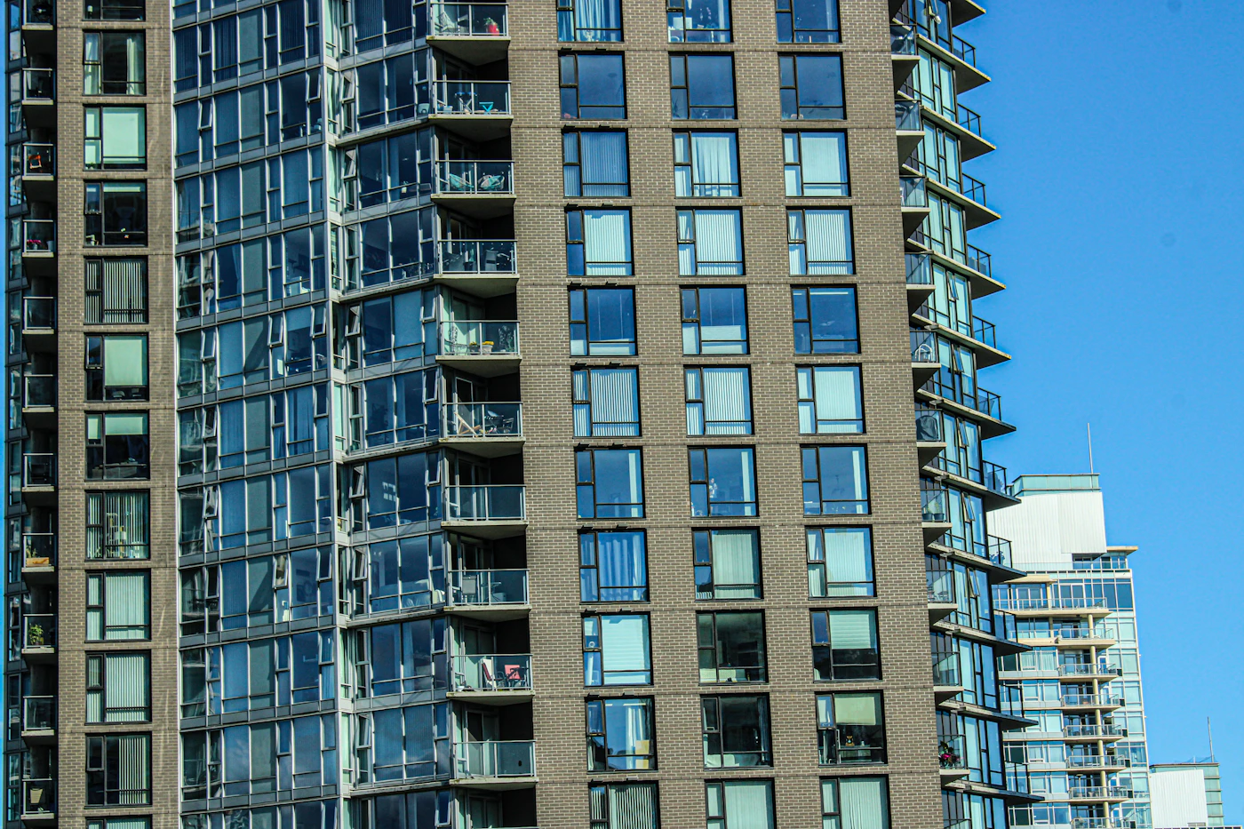 Glass balconies and brickwork on a Vancouver residential building